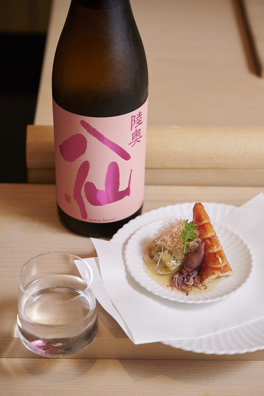 Mutsu Hassen Pink Label Ginjo (Pure/ Pasteurized) x Tiger Prawn Stuffed with Tamagoyaki, Served Alongside Hotaru-Ika and Herring Roe, dressed in a Tamago Miso and Seabream Dashi Sauce Together with Leek and Satoimo, Topped with Tuna Flakes and Kinome Leaf.